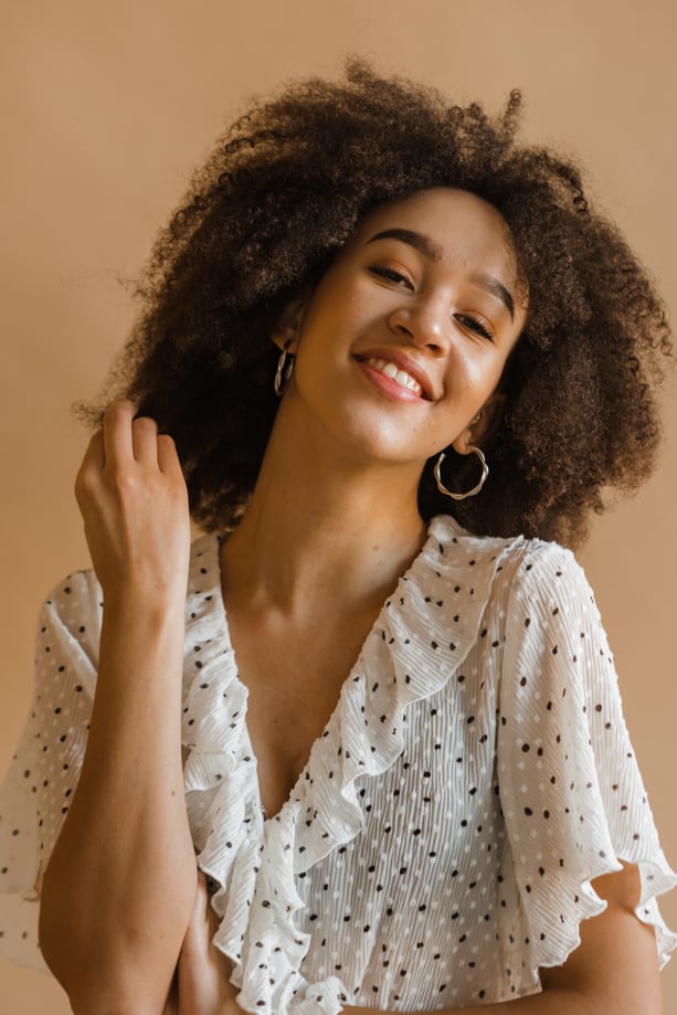 Woman in White and Black Polka Dot Dress